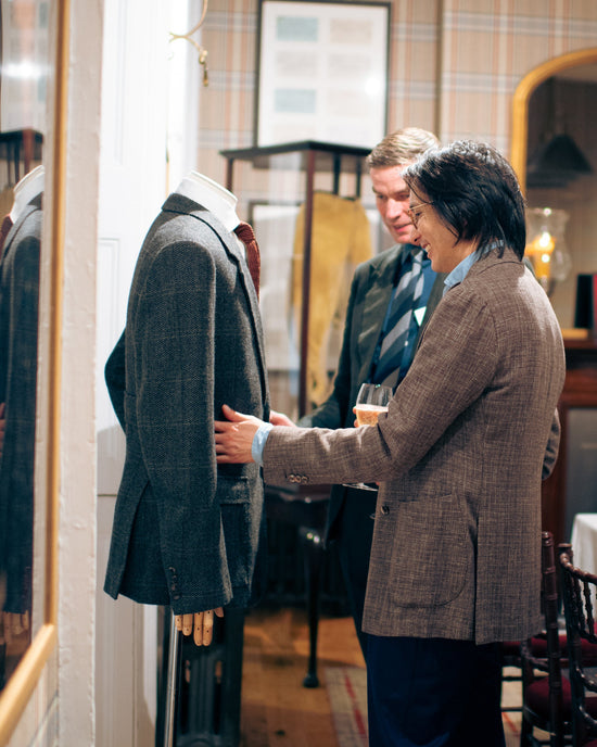 Huntsman client manager with a Bespoke 1849 client during a private fitting at the Huntsman Club at 11 Savile Row